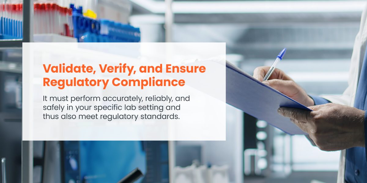 Close-up of hands writing on a clipboard in a lab setting, with the text 'Validate, Verify, and Ensure Regulatory Compliance. It must perform accurately, reliably, and safely in your specific lab setting and thus also meet regulatory standards.'